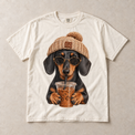 Ivory Comfort Colors short-sleeve T-shirt with Dachshund Iced Coffee graphic, front flat lay
