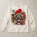 Ivory Comfort Colors long-sleeve T-shirt with Christmas Raccoon Coffee graphic, front flat lay