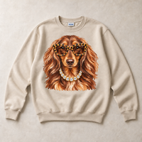 Sand Gildan crewneck sweatshirt with Dachshund Leopard Glasses graphic, front flat lay