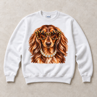 White Gildan crewneck sweatshirt with Dachshund Leopard Glasses graphic, front flat lay