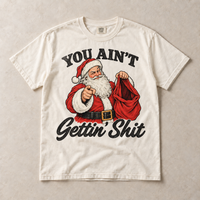 Ivory Comfort Colors short-sleeve T-shirt with You Ain't Gettin' Shit Funny Santa Christmas graphic, front flat lay