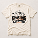 Ghosting Everyone Halloween ghost graphic on an ivory Comfort Colors T-shirt