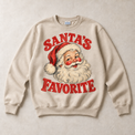 Sand Gildan crewneck sweatshirt with Santa's Favorite Vintage Christmas graphic, front flat lay