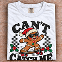 White Comfort Colors Can't Catch Me Shirt folded on wood