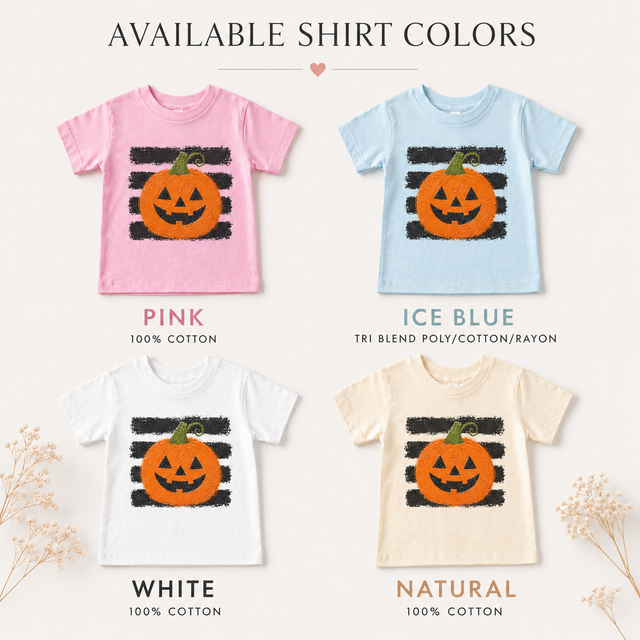 Pink, ice blue, white, and natural kids T-shirts featuring an orange jack-o’-lantern over distressed black stripes.