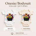 White and natural baby bodysuits featuring three witches around a bubbling cauldron with bats and stars.
