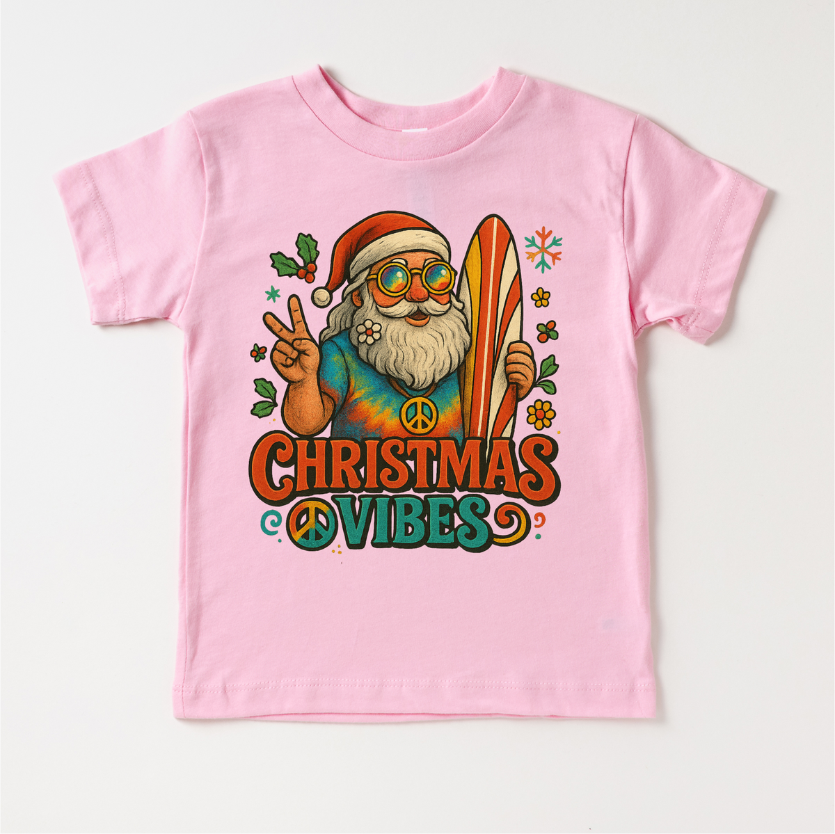 Christmas Vibes Surfing Santa design on a pink garment.