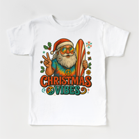 Christmas Vibes Surfing Santa design on a white garment.