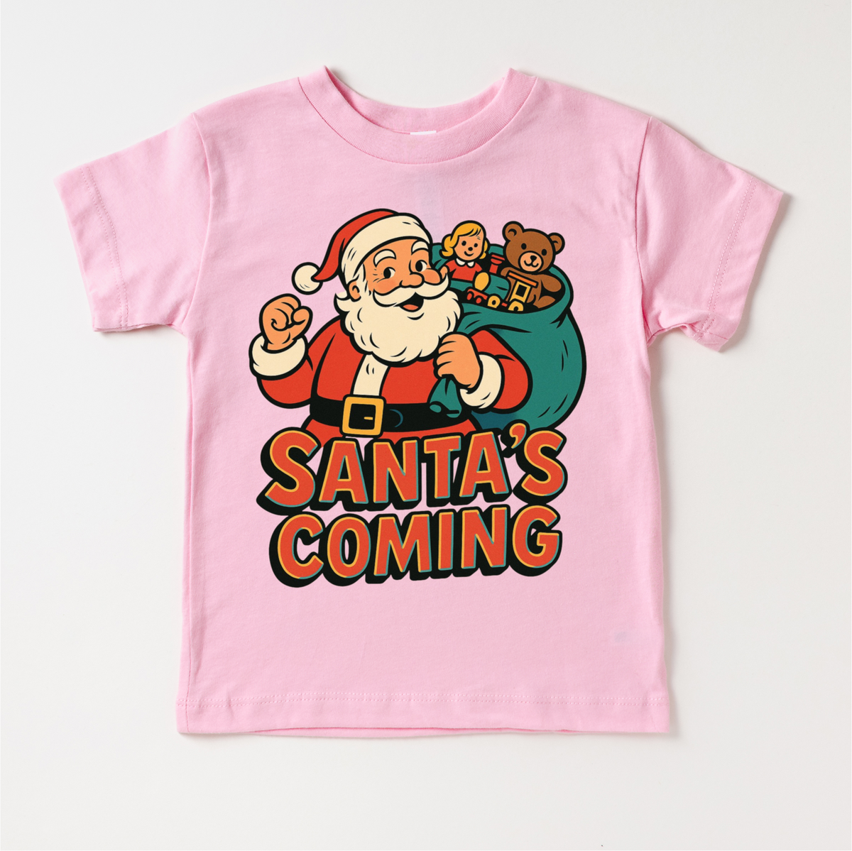 Santa Is Coming Kids Christmas design on a pink garment.