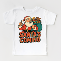 Santa Is Coming Kids Christmas design on a white garment.