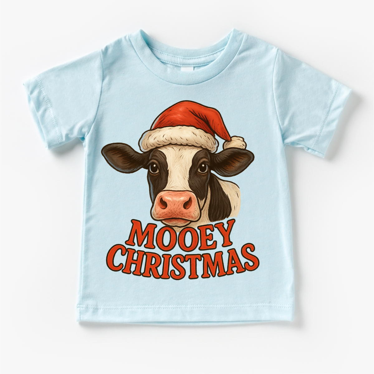 Mooey Christmas Country Cow design on a blue garment.