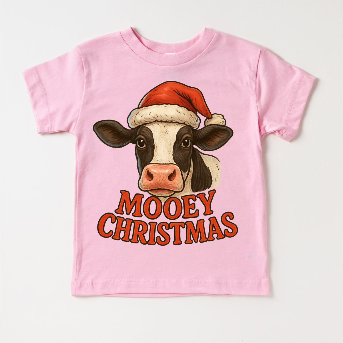 Mooey Christmas Country Cow design on a pink garment.