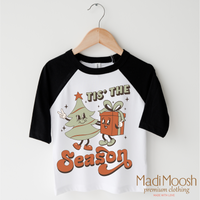 Tis The Season Christmas design on a black-accented shirt.