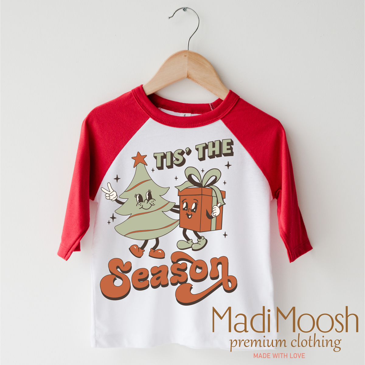 Tis The Season Christmas design on a red-accented shirt.
