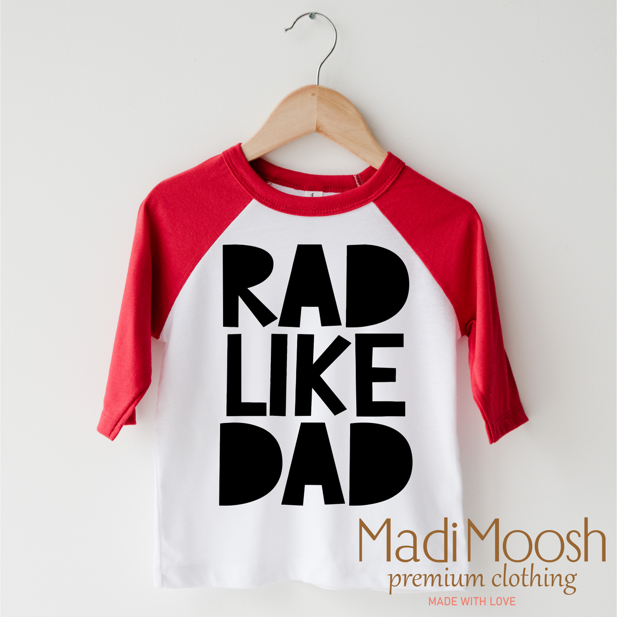 Rad Like Dad design on a red-accented shirt.