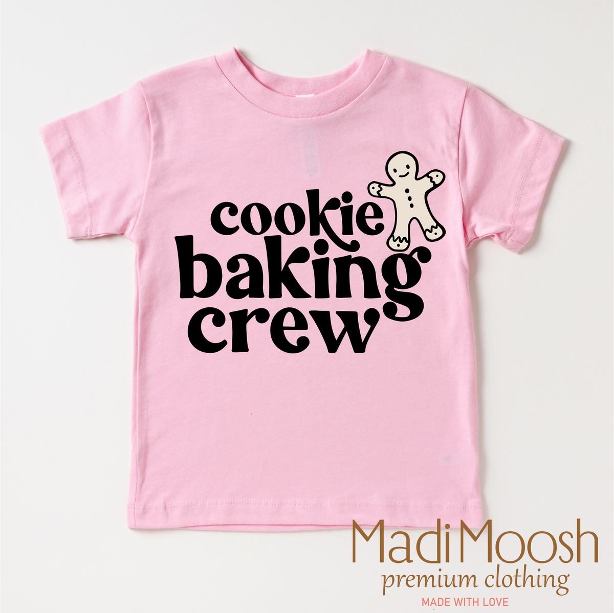 Gingerbread Cookie Baking Crew design on a pink garment.