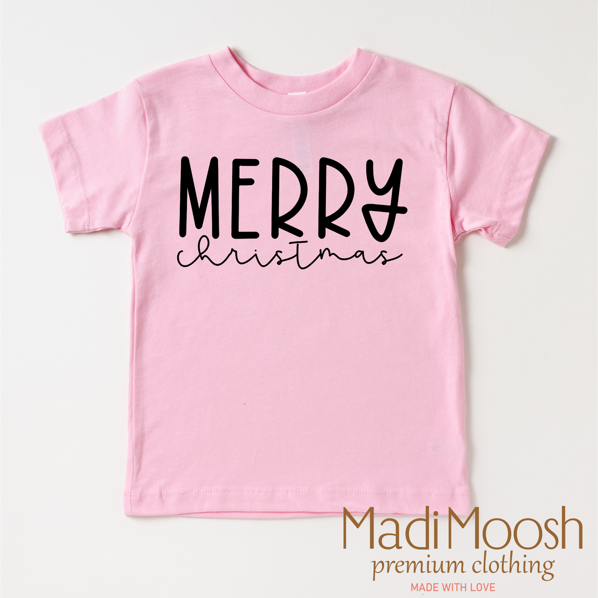 Classic Merry Christmas design on a pink garment.