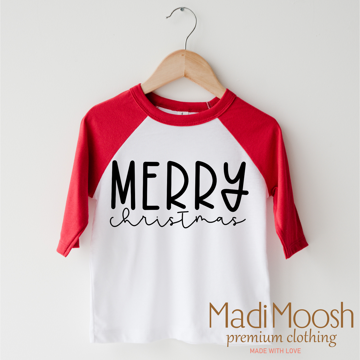 Classic Merry Christmas design on a red-accented shirt.