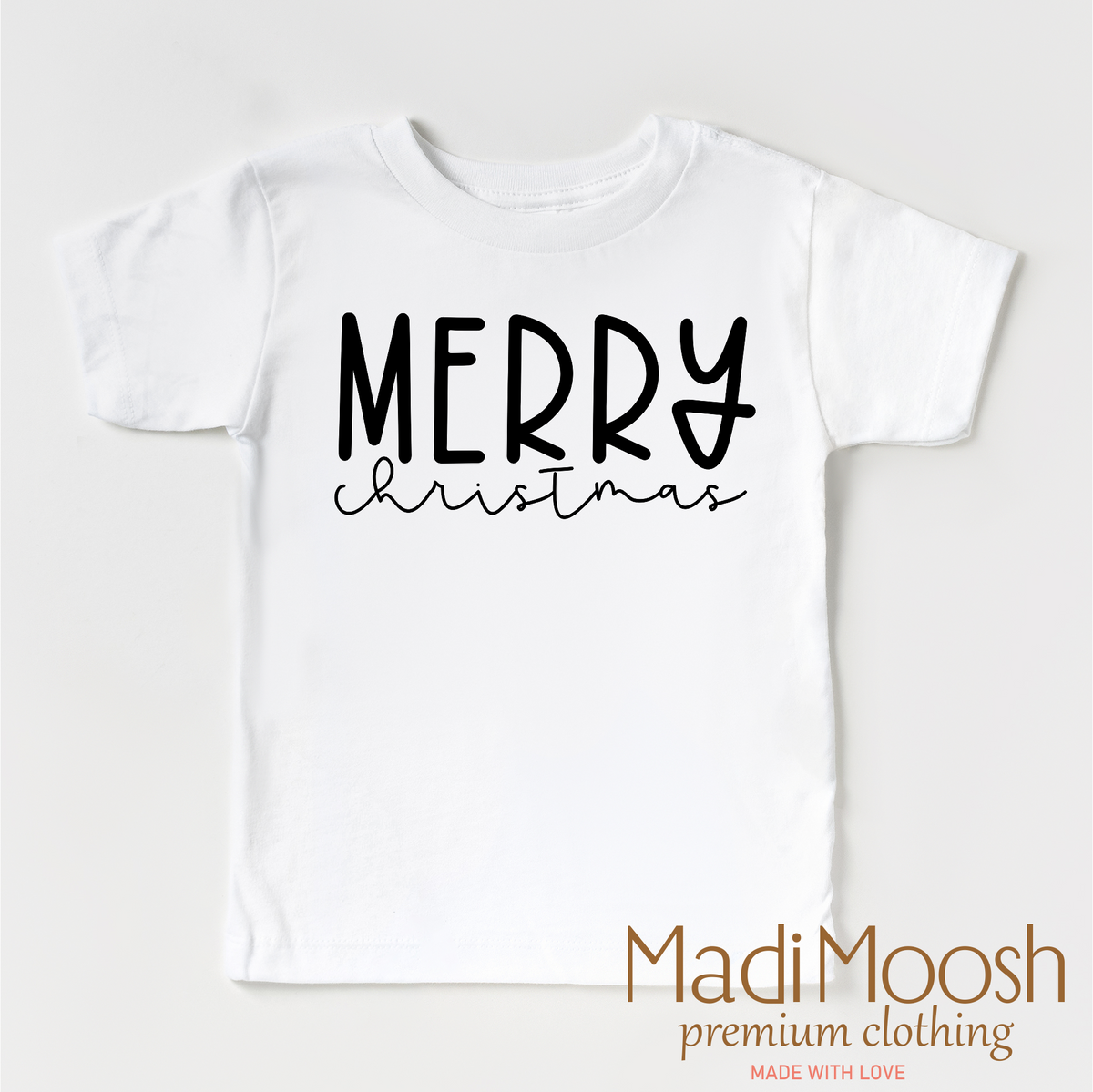 Classic Merry Christmas design on a white garment.