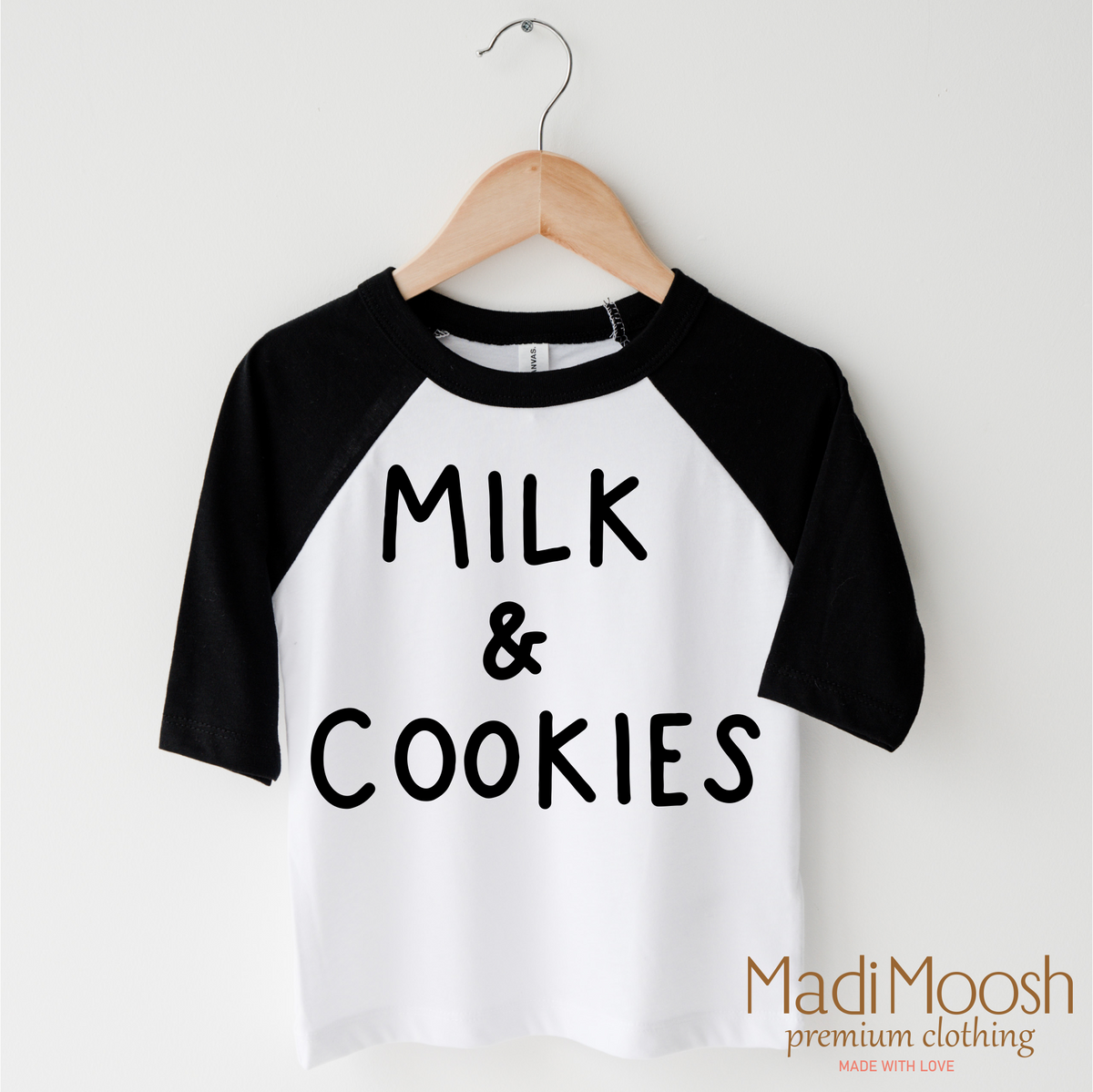 Milk And Cookies Classic Christmas design on a black-accented shirt.