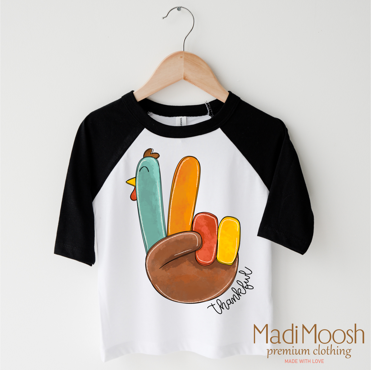 Thankful Turkey Thanksgiving design on a black-accented shirt.