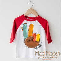 Thankful Turkey Thanksgiving design on a red-accented shirt.