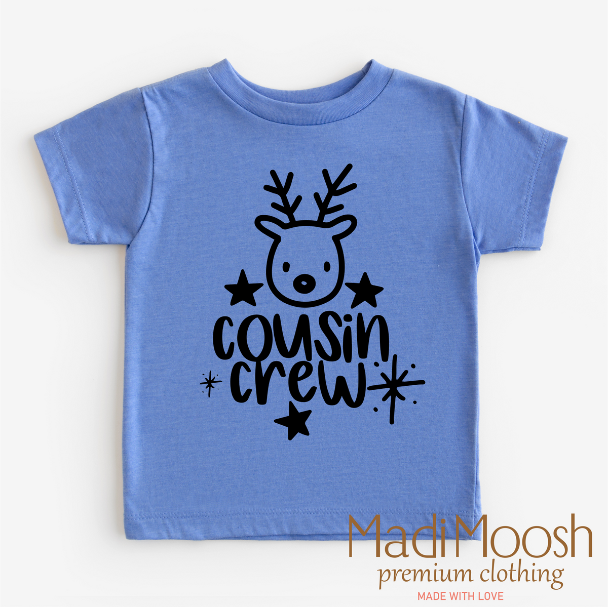 Cousin Crew Christmas design on a blue garment.