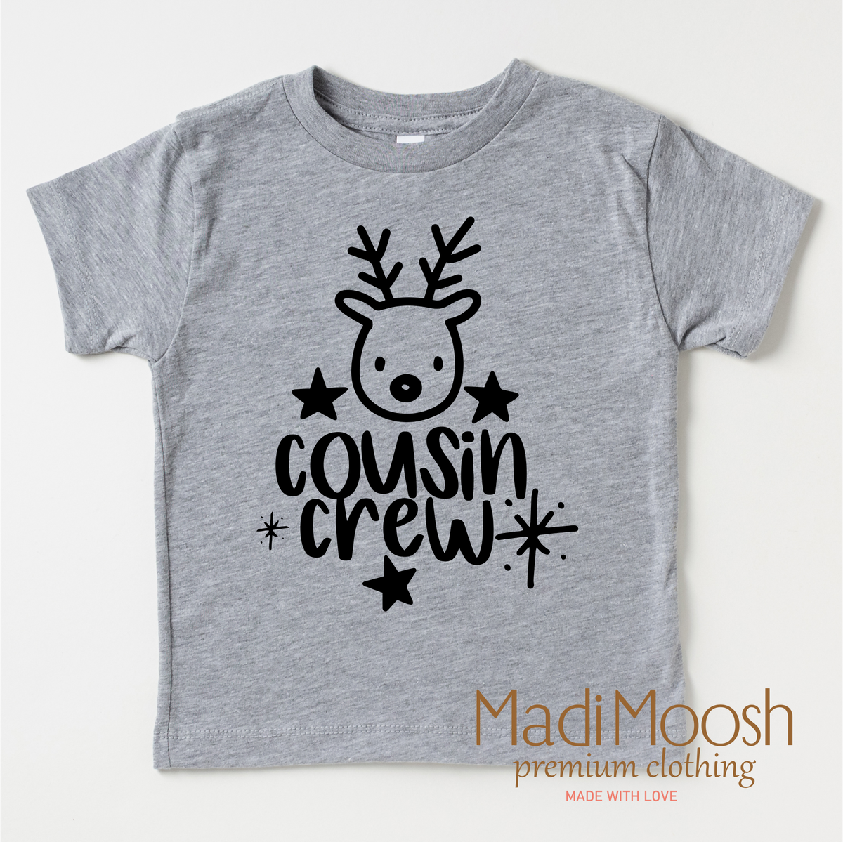 Cousin Crew Christmas design on a gray garment.