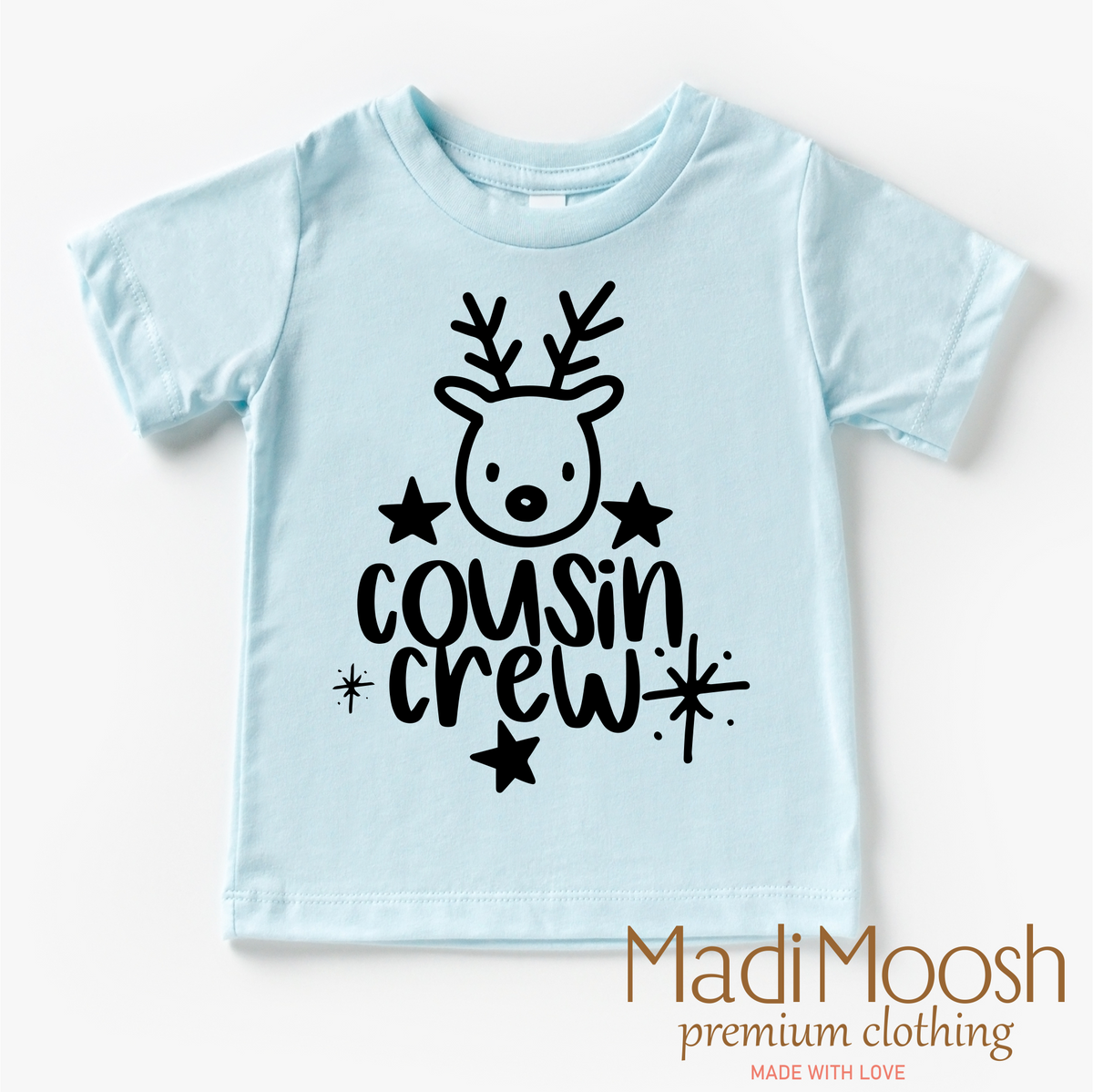 Cousin Crew Christmas design on an ice blue garment.