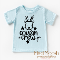 Cousin Crew Christmas design on an ice blue garment.
