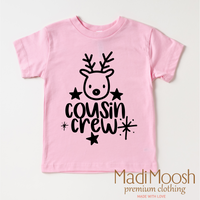 Cousin Crew Christmas design on a pink garment.
