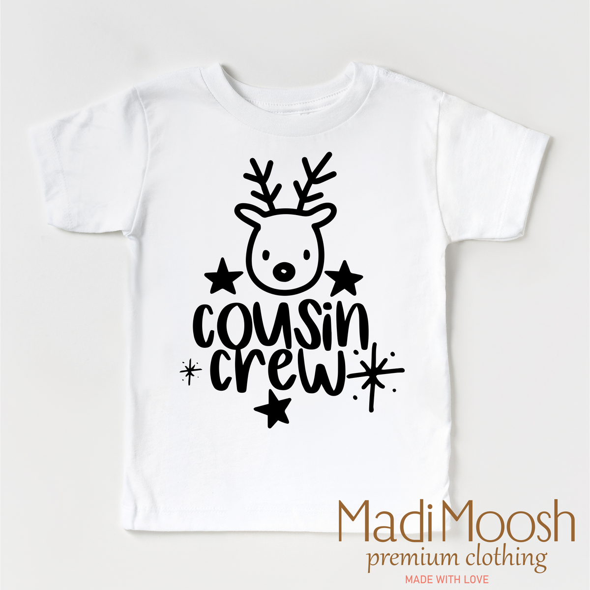 Cousin Crew Christmas design on a white garment.