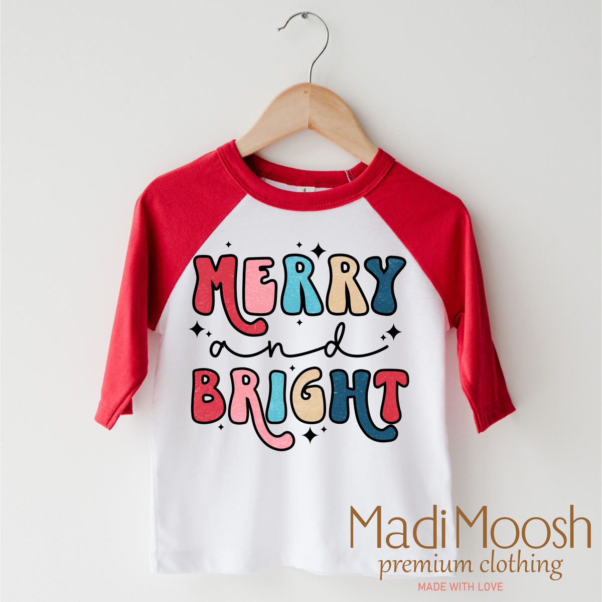 Merry And Bright Christmas design on a red-accented shirt.