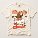 Howdy Santa cowboy Christmas graphic on an ivory Comfort Colors T-shirt