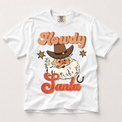 Howdy Santa cowboy Christmas graphic on a white Comfort Colors T-shirt