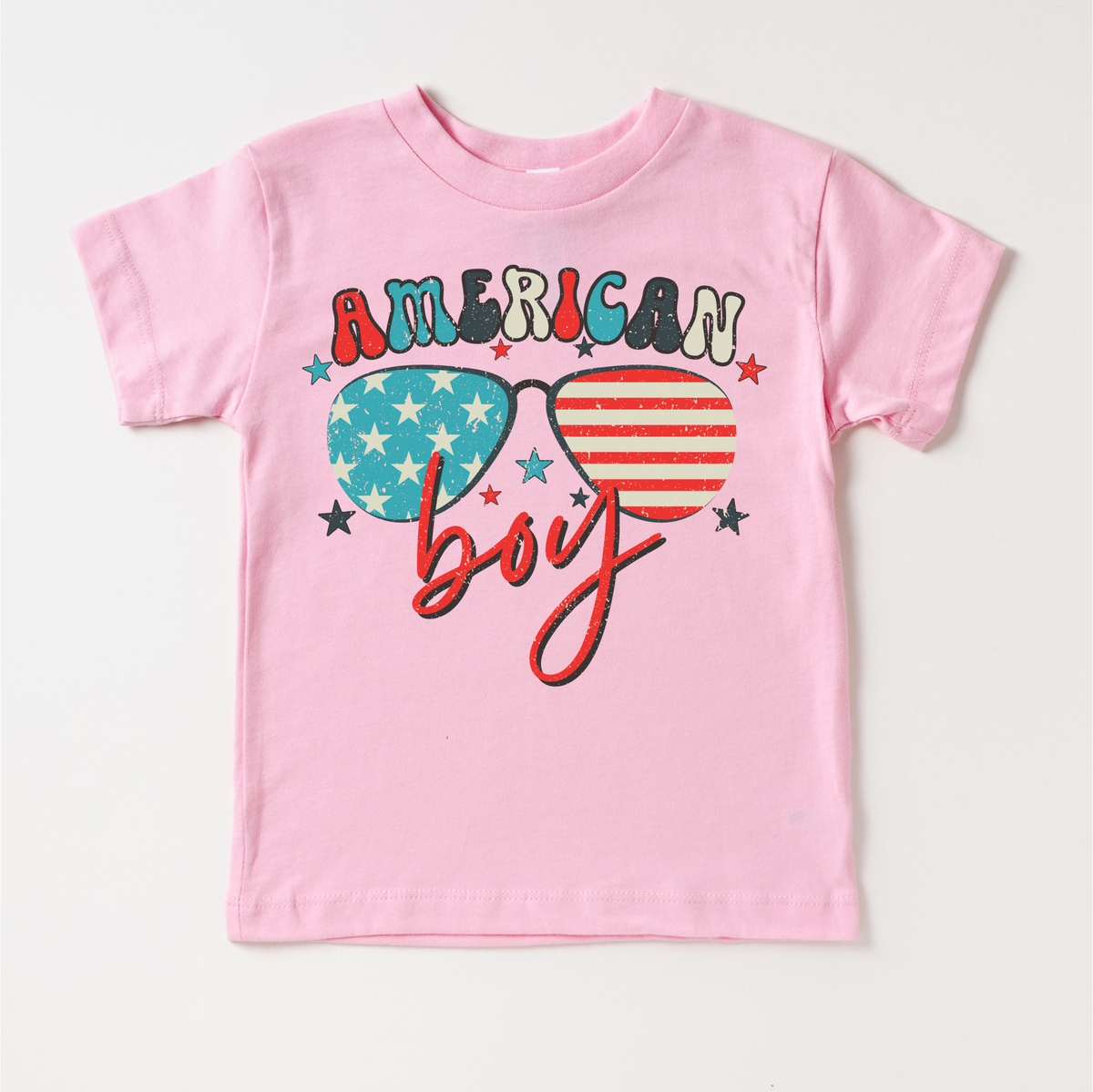 Retro American Boy 4th Of July design on a pink garment.