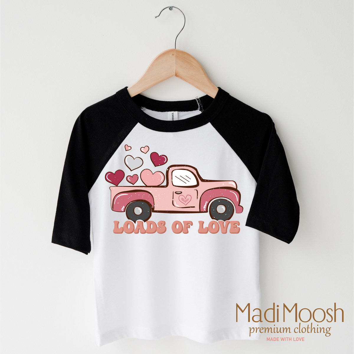 Loads Of Love Valentine design on a black-accented shirt.