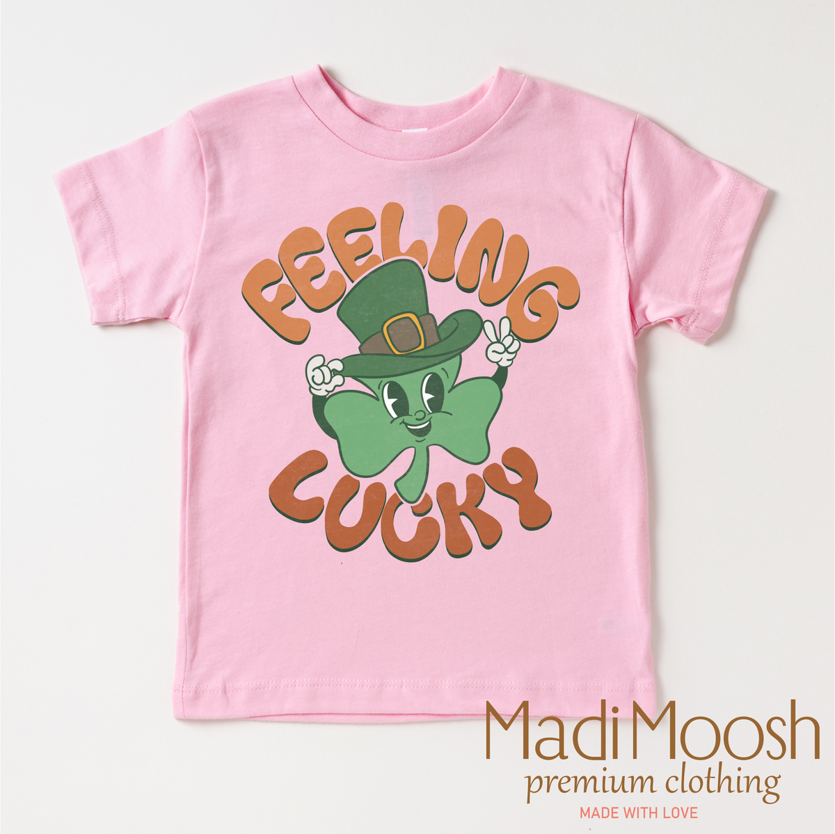 Feeling Lucky Retro St. Patrick's Day design on a pink garment.