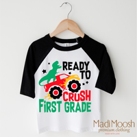 I'm Ready To Crush 1st Grade Dinosaur Monster Truck design on a black-accented shirt.