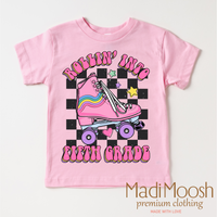 Rollin Into Fifth Grade Back To School design on a pink garment.