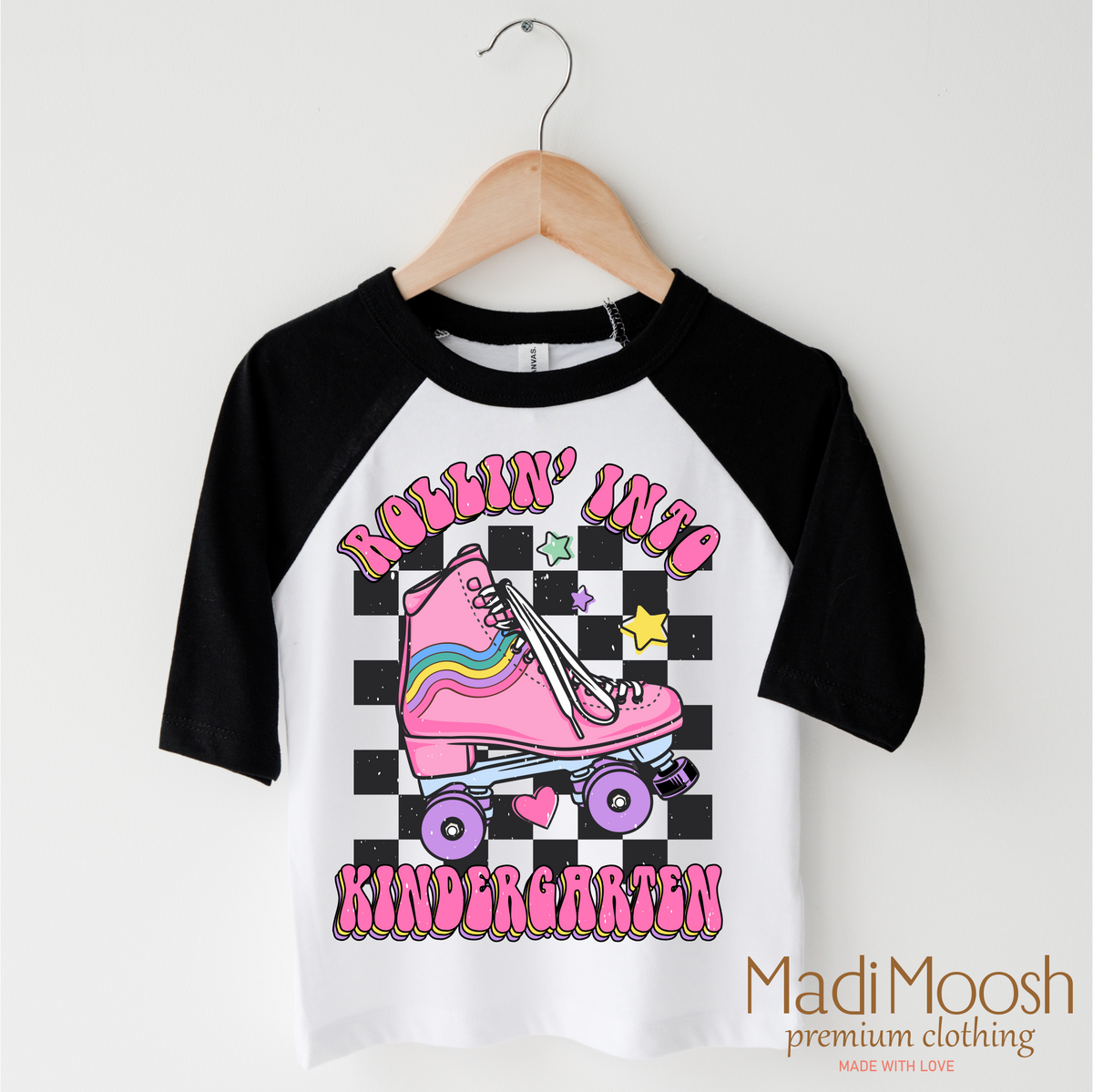 Rollin Into Kindergarten Back To School design on a black-accented shirt.