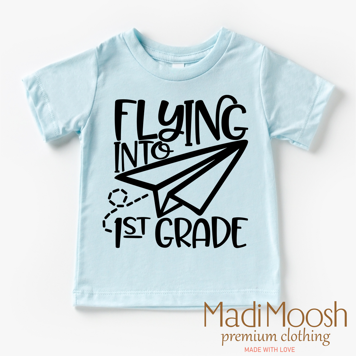 Flying Into First Grade Back To School graphic T-shirt by Madi Moosh