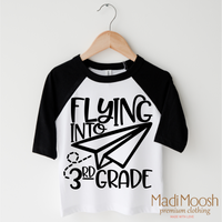 Flying Into 3rd Grade Back To School design on a black-accented shirt.