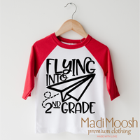 Flying Into 2nd Grade Back To School design on a red-accented shirt.