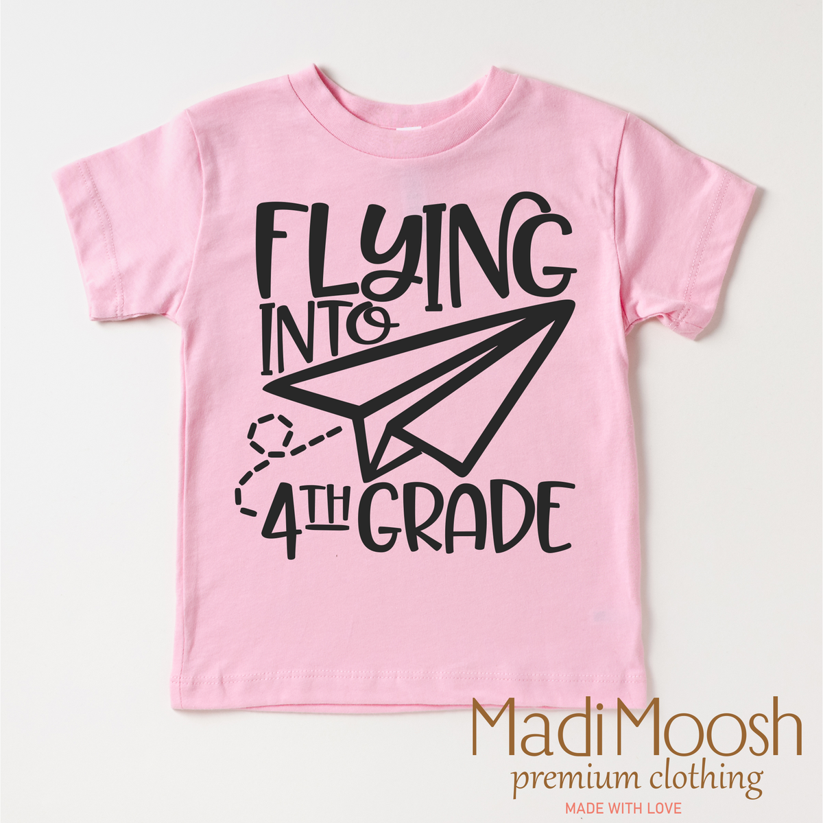 Flying Into 4th Grade Back To School design on a pink garment.