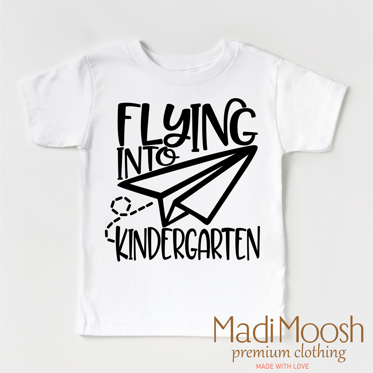 Flying Into Kindergarten Back To School design on a white garment.
