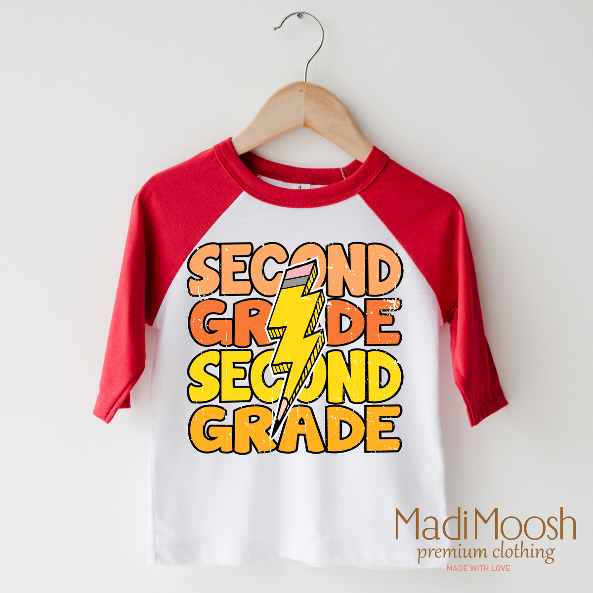 Second Grade Lightning Bolt design on a raglan shirt with red sleeves.