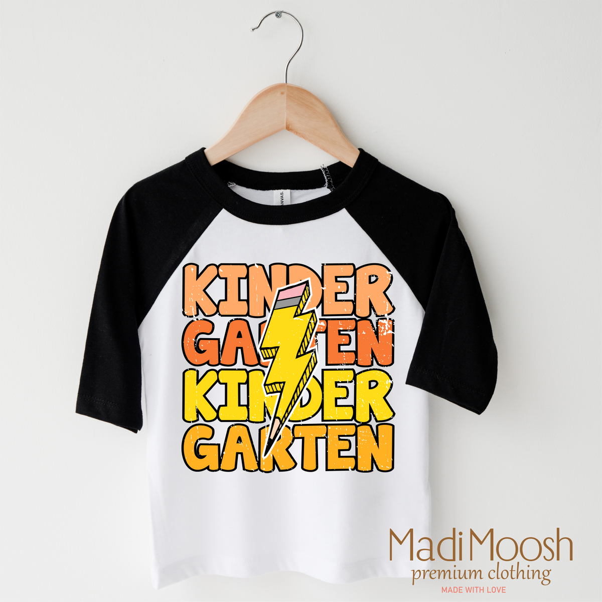 Kindergarten Lightning Bolt design on a raglan shirt with black sleeves.