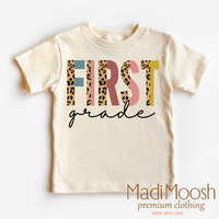 First Grade Leopard, Back To School graphic T-shirt by Madi Moosh