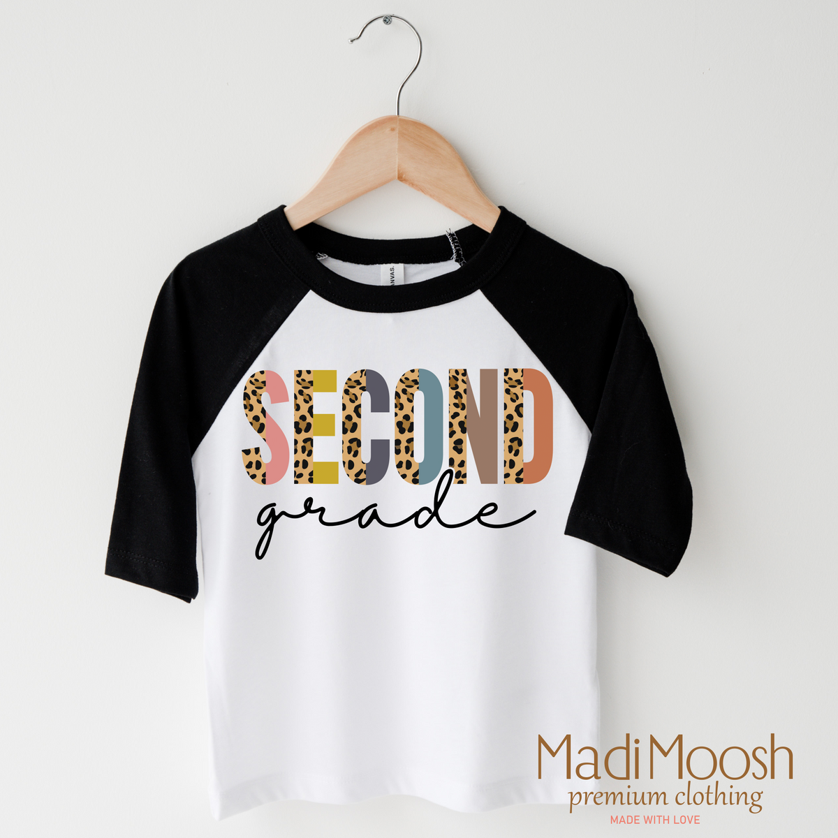 Second Grade Leopard design on a raglan shirt with black sleeves.
